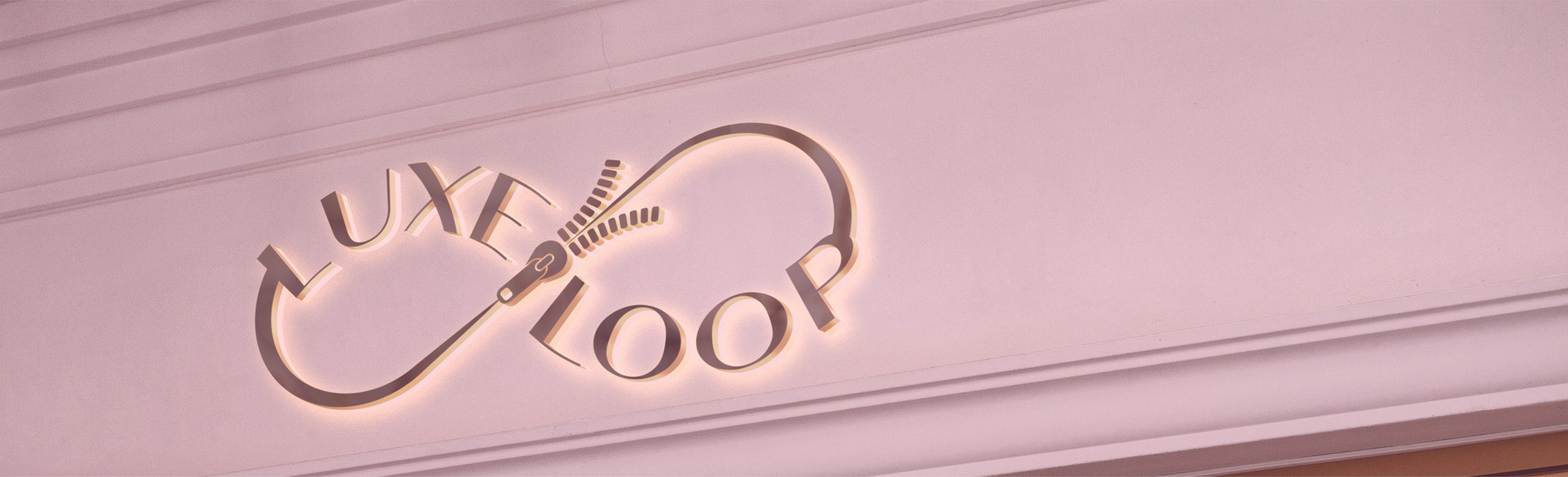 Logo of 'LuxeLoop' on a light pink background